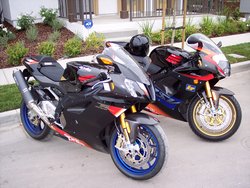 2004 Aprilia RSV 1000 R Factory on the left with a 2003 Aprilia RSV Mille on right